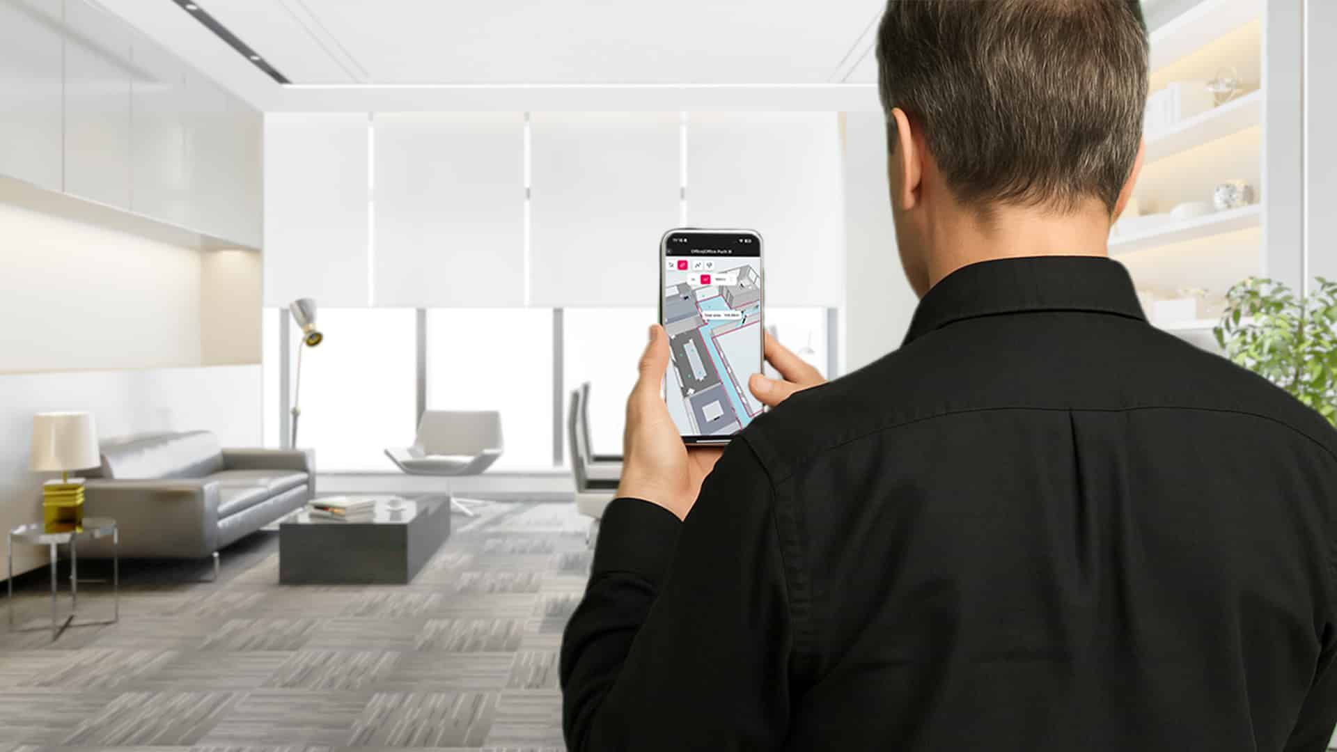 man scanning a room with Metaroom app